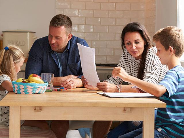 Parents helping kids with homework